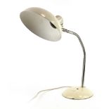 A German Bauhaus desk lamp with a white enamelled shade and flexible shaft,