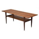A 1960's Danish teak and crossbanded two tier coffee table on tapered legs, w.