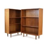 A pair of 1960's Danish teak open adjustable bookcases on turned beech legs, w.