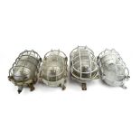Four various Central European industrial wall/ceiling lights,
