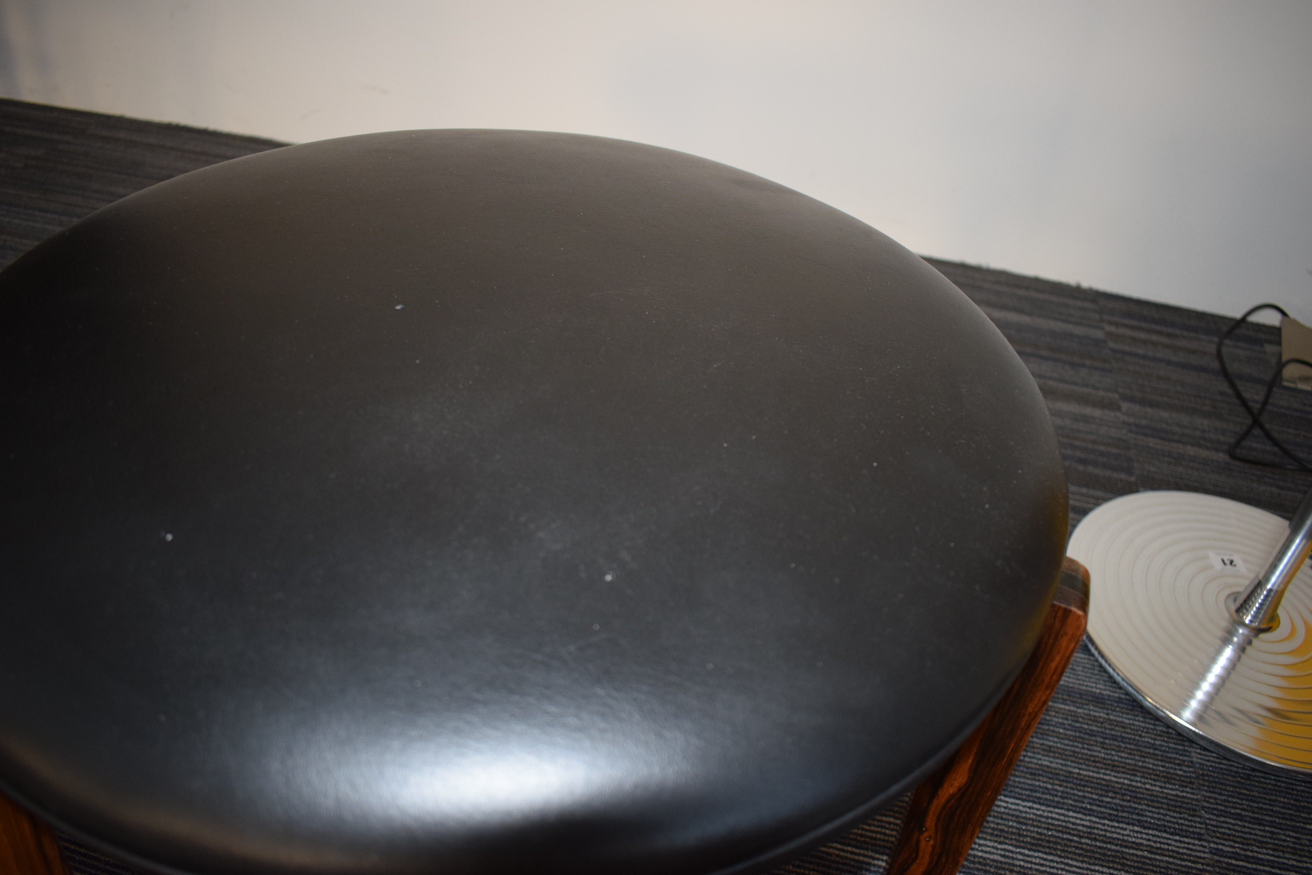 A 1960's rosewood and ebonised stool with black upholstery over a tri-form base *Sold subject to - Image 5 of 7