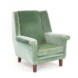 A 1960/70's Danish pale green draylon highback lounge armchair on square legs,