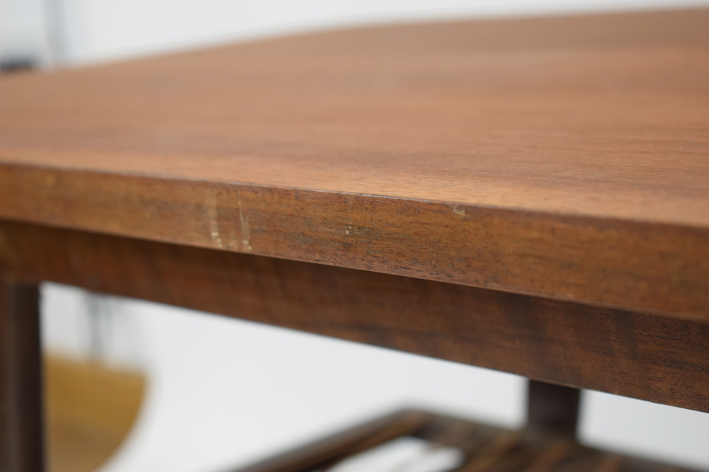 A 1960's Danish teak coffee table, the curved rectangular surface over a wicker criss-cross tier, - Image 6 of 6