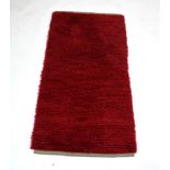 A 1960/70's Scandinavian Rya rug in red,