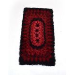 A 1960/70's Scandinavian Rya rug in black and red,