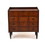 A 1960's Danish rosewood vanity chest, the lift-lid revealing a mirrored interior,