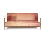 A 1960's Danish pink draylon sofa bed with a beech frame, l.