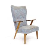 A 1970's and later button upholstered highback armchair with a teak frame *Sold subject to our soft