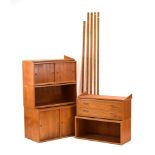 A 1960/70's Danish teak modular shelving system including two sliding door cabinets,