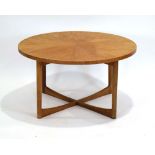 A 1970's teak circular occasional table on four turned supports joined by an X-stretcher, d.