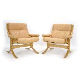 A pair of 1970's Norwegian bentwood and leather upholstered armchairs by Ekornes in the manner of