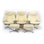 A set of three early 1990's Pieff swivel armchairs upholstered in cream leather with chromed frames,