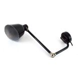 Attributed to Kandem, a German Bauhaus black enamelled adjustable wall-clamped lamp,