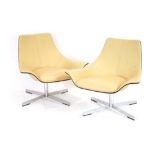 A pair of Matteo Grassi 2Leather cream lowback armchairs on four-star aluminium swivel bases *Sold