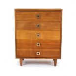 A 1970's British teak chest of five long drawers on turned legs, w.