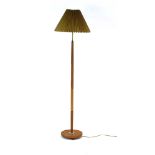 A 1960's turned oak and brass standard lamp with pleated gold shade CONDITION REPORT: