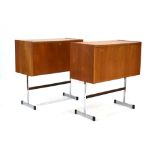 A pair of 1970's teak fall-front cabinets standing on aluminium Pieff-style cantilever bases, w.