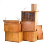 A 1960's Poul Cadovius teak modular shelving system including a bureau, a four drawer chest,