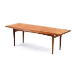 A Gordon Russell walnut occasional table of canted rectangular form, label to underside, l.