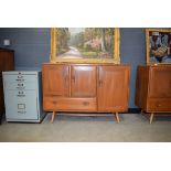 Ercol sideboard of 3 doors and single drawer Damage to 1 handle and typical surface scratches,