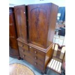 Late 19th century mahogany linen press of 2 doors, 2 short drawers and 2 long graduated drawers on