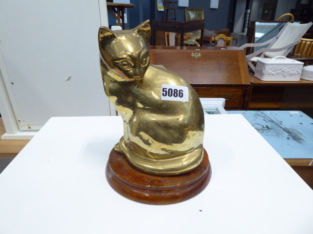 Brass model of seated cat on wooden plinth base