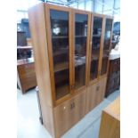 Pair of teak finish glazed display cabinets covered bases In need of attention