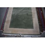 5320 Large carpet in green and cream ground with Grecian style border, approx 200 x 250cm