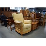 Ercol elm single armchair with loose cream upholstered cushions Some discolouration to cushions.