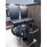 Black and clear glass circular dining table and 4 faux black leather chairs, together with a