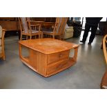 Ercol elm coffee table of square form with drawers under in need of some attention. Varnish on
