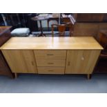 5066 - An oak sideboard of 2 doors and 3 drawers on turned feet Good condition