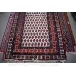 (14) Afghanistan wool carpet with white ground and red border and geometric motifs approx. 190 x