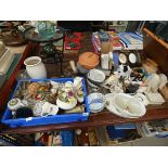 Table top containing ornamental posies, wrought iron and glazed side table, glass vases,