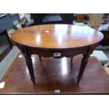 An Empire style mahogany oval coffee table