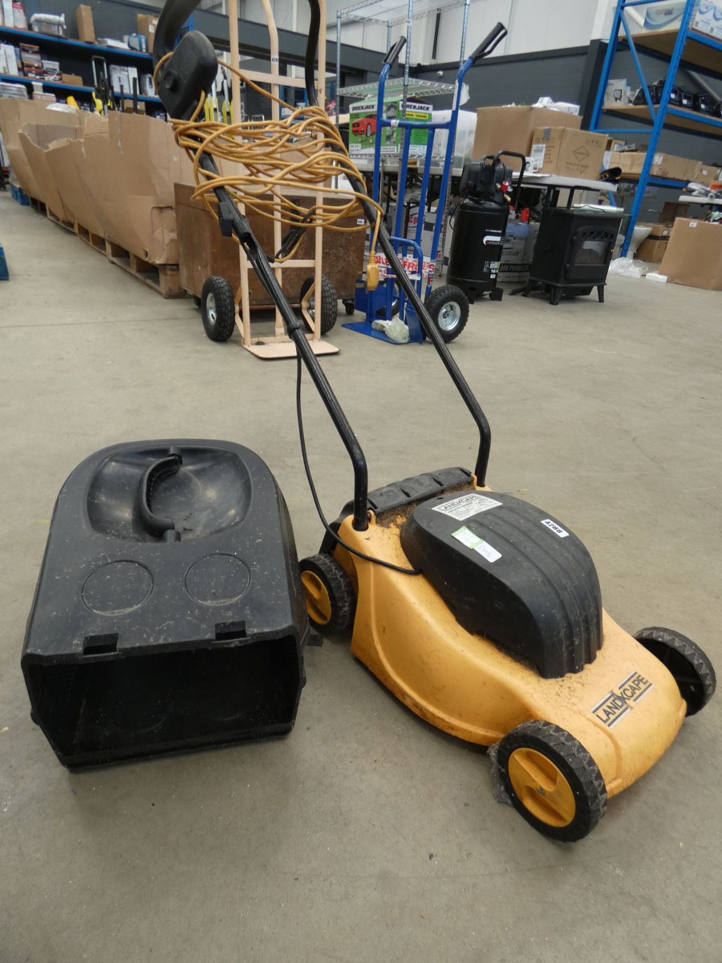 Small yellow electric mower, no grass box