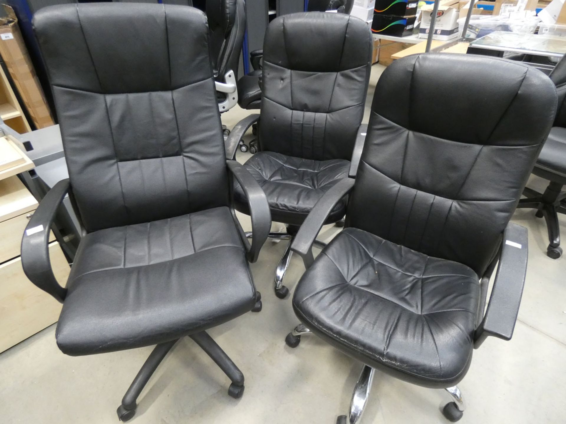 3 black highback swivel armchairs