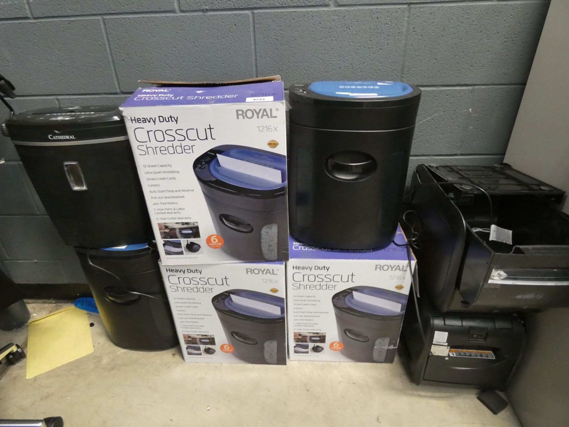3 boxed and 5 unboxed paper shredders