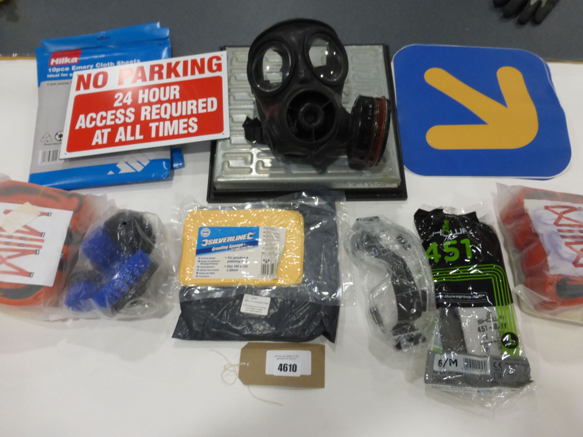 Bag containing No Parking signs, safety wear, gas mask, drain cover and other items