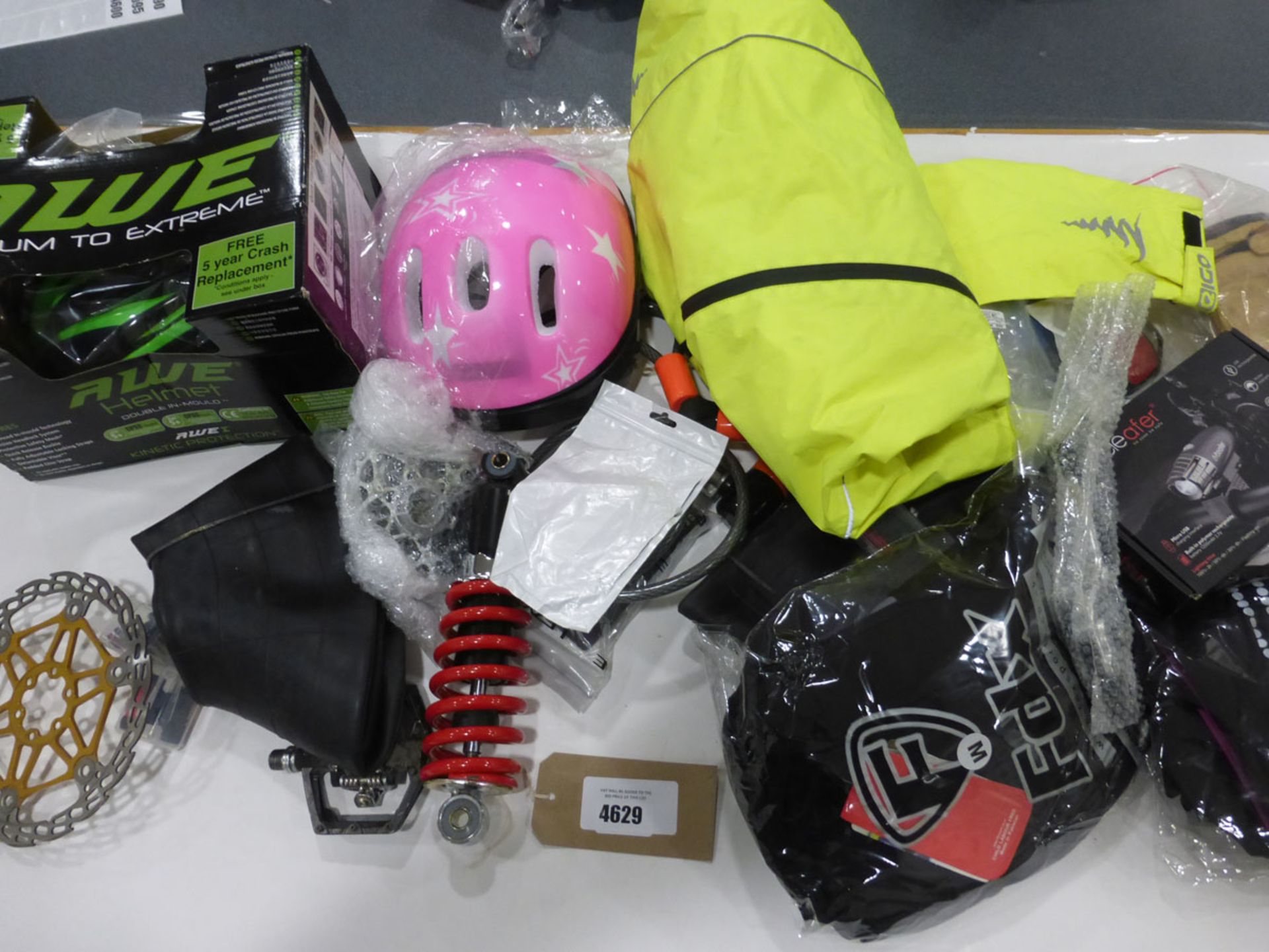 Bag containing motorbike parts incl. screens, shock absorbers, helmets, clothing, locks, lights,