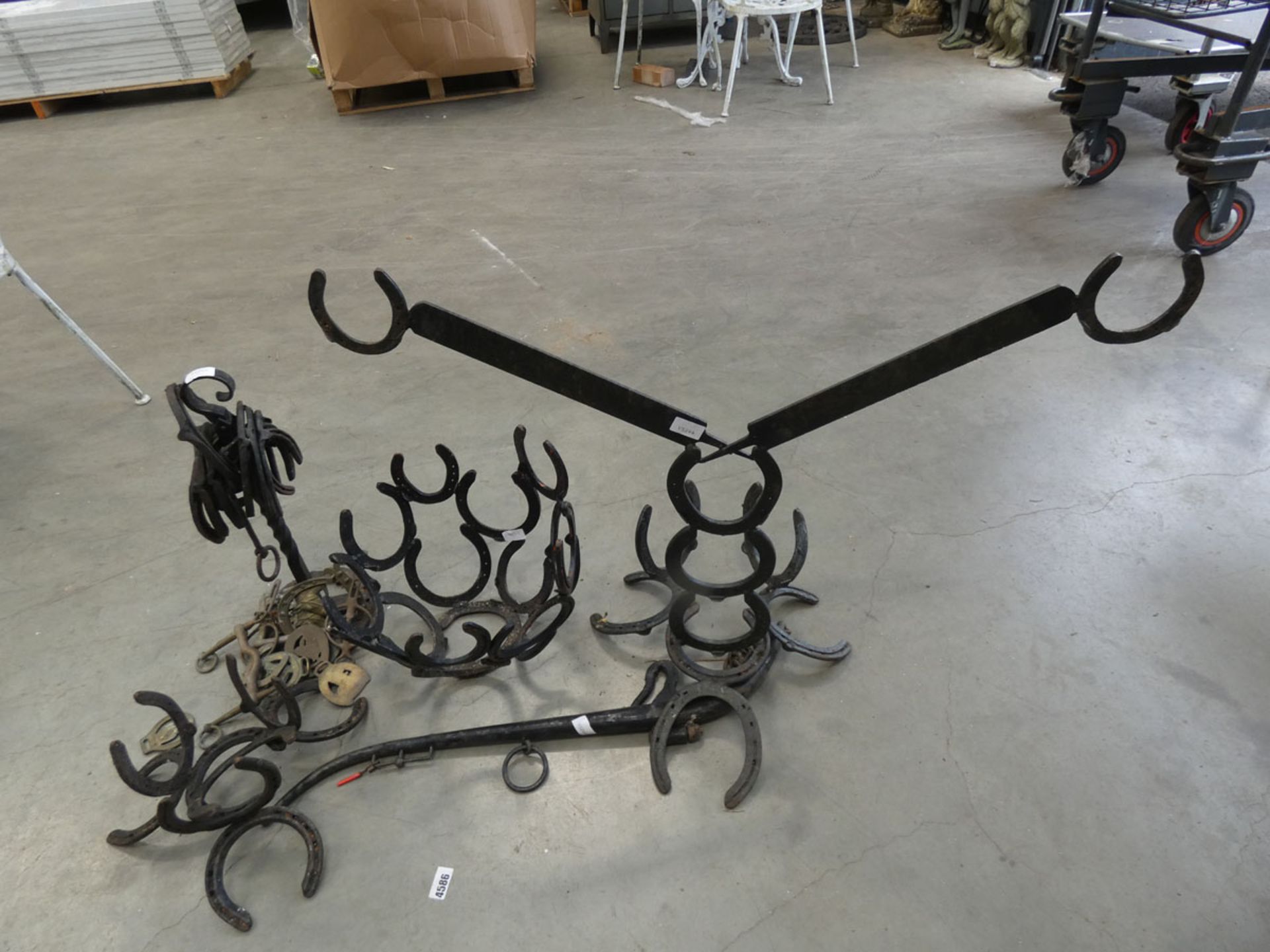Assortment of horse shoe sculptured items and horse shoes