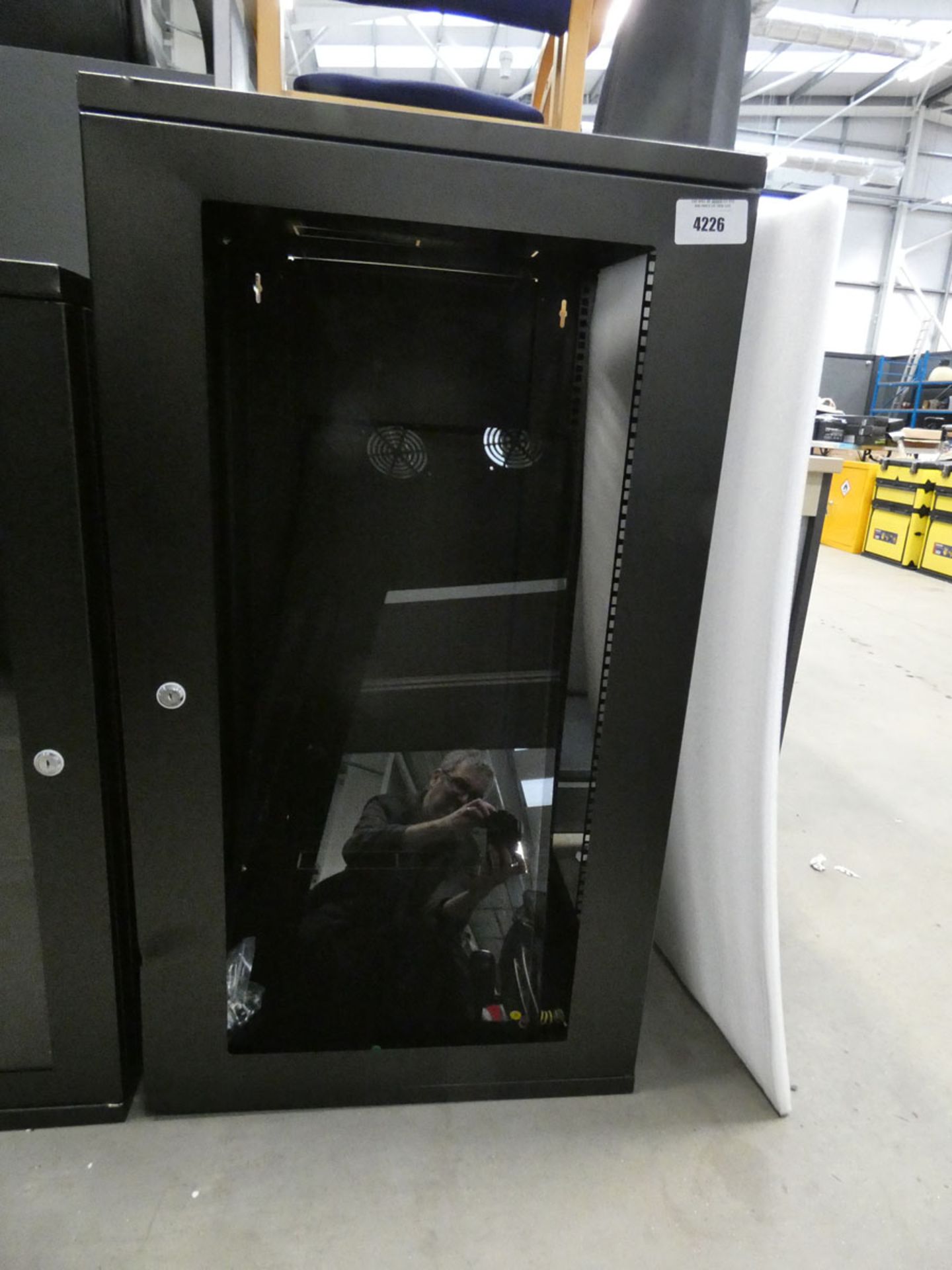 Tall black comms cabinet