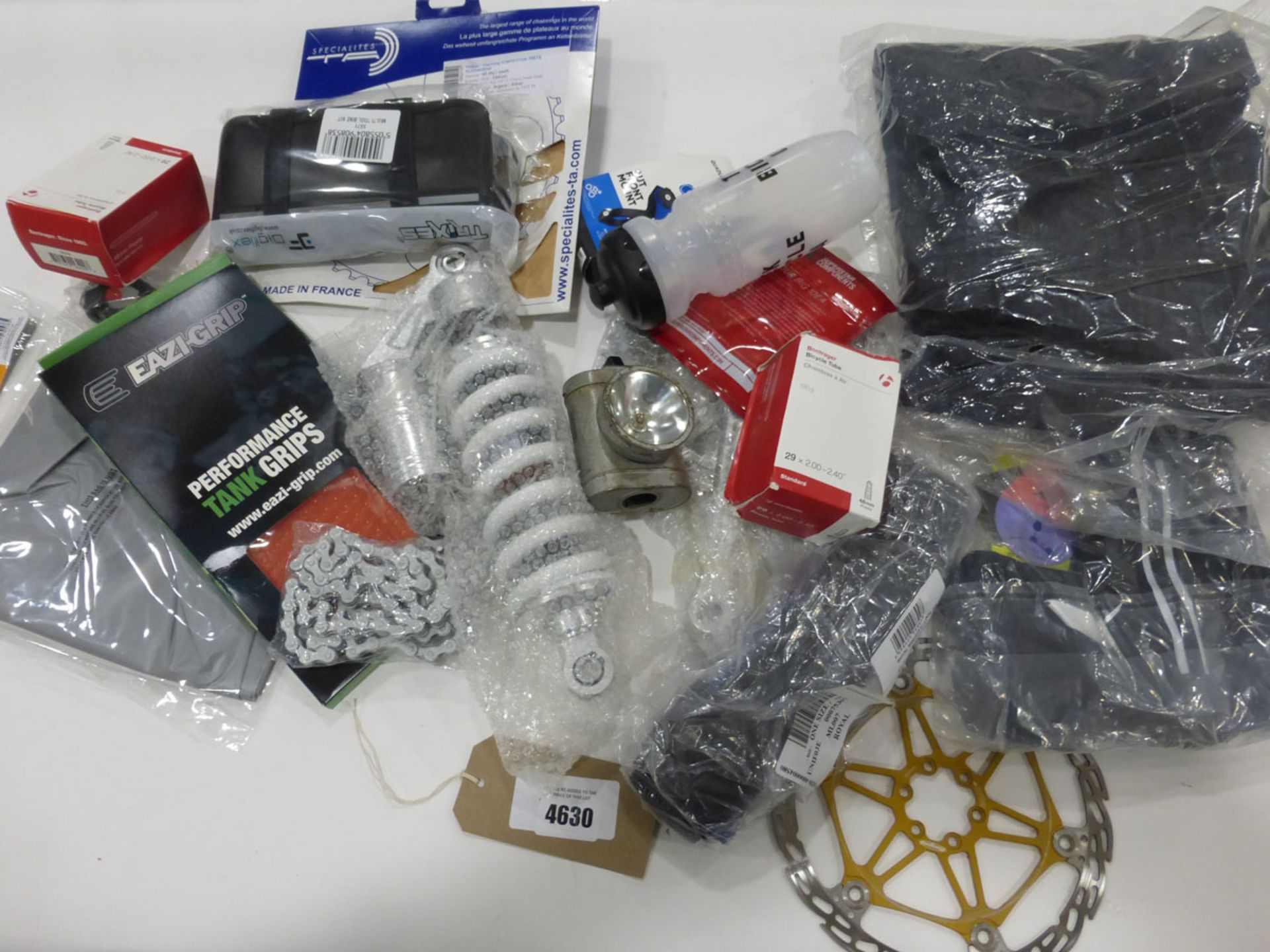 Bag of bike and motorbike parts incl. shock absorbers, chain, clothing, cogs, water bottles, bike