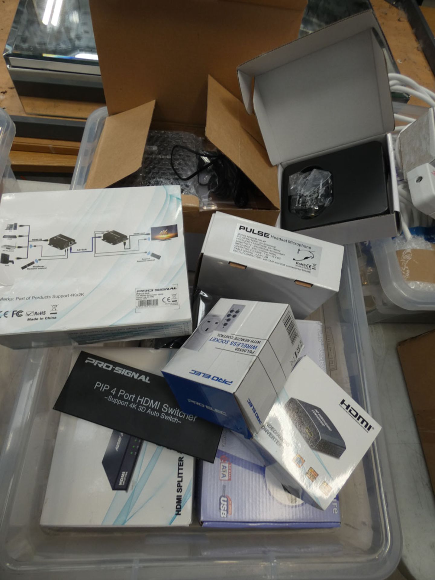 Box of HDMI cables and wireless sockets