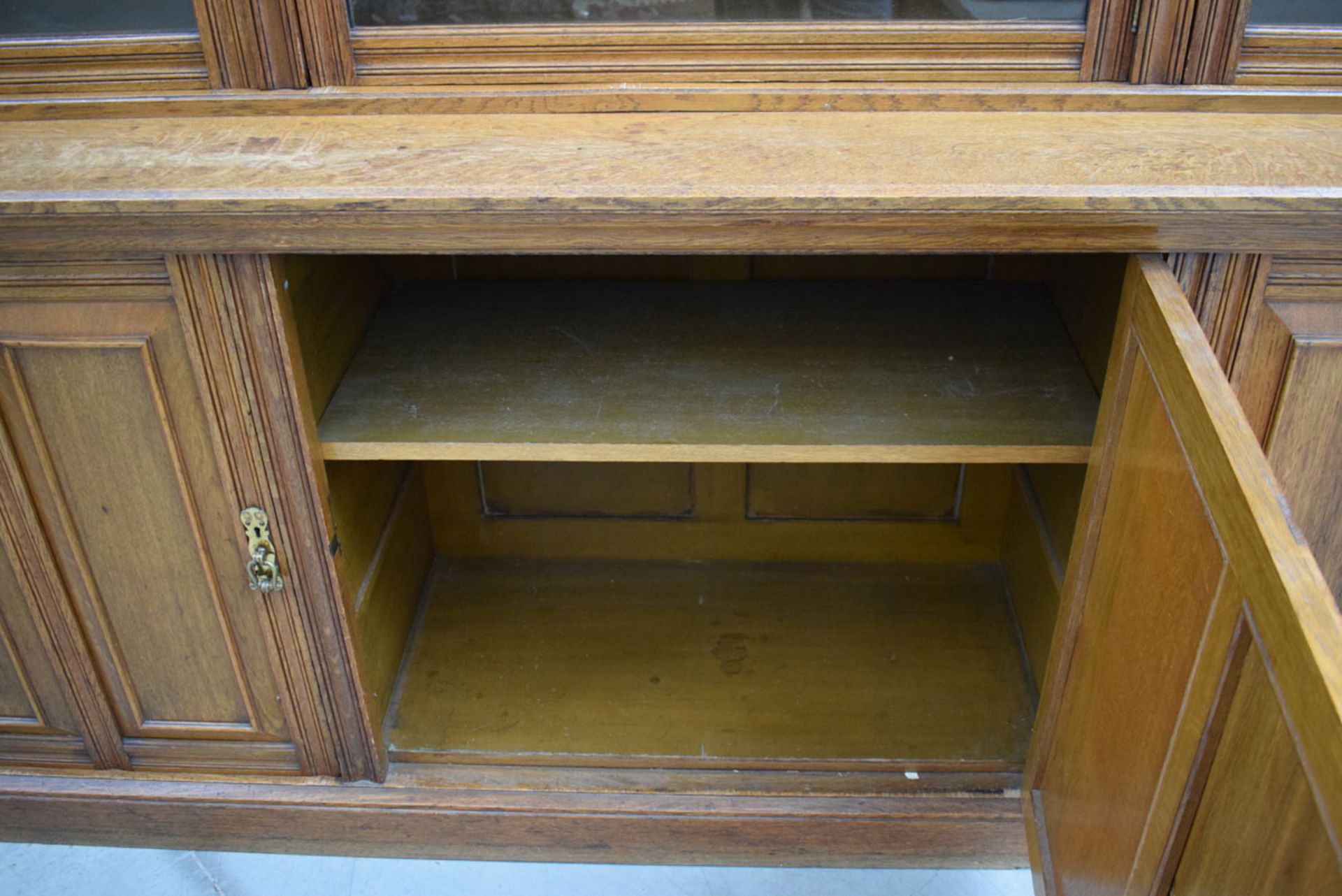 Glazed Victorian oak panelled three-door library bookcase with storage cupboards under and - Image 2 of 6