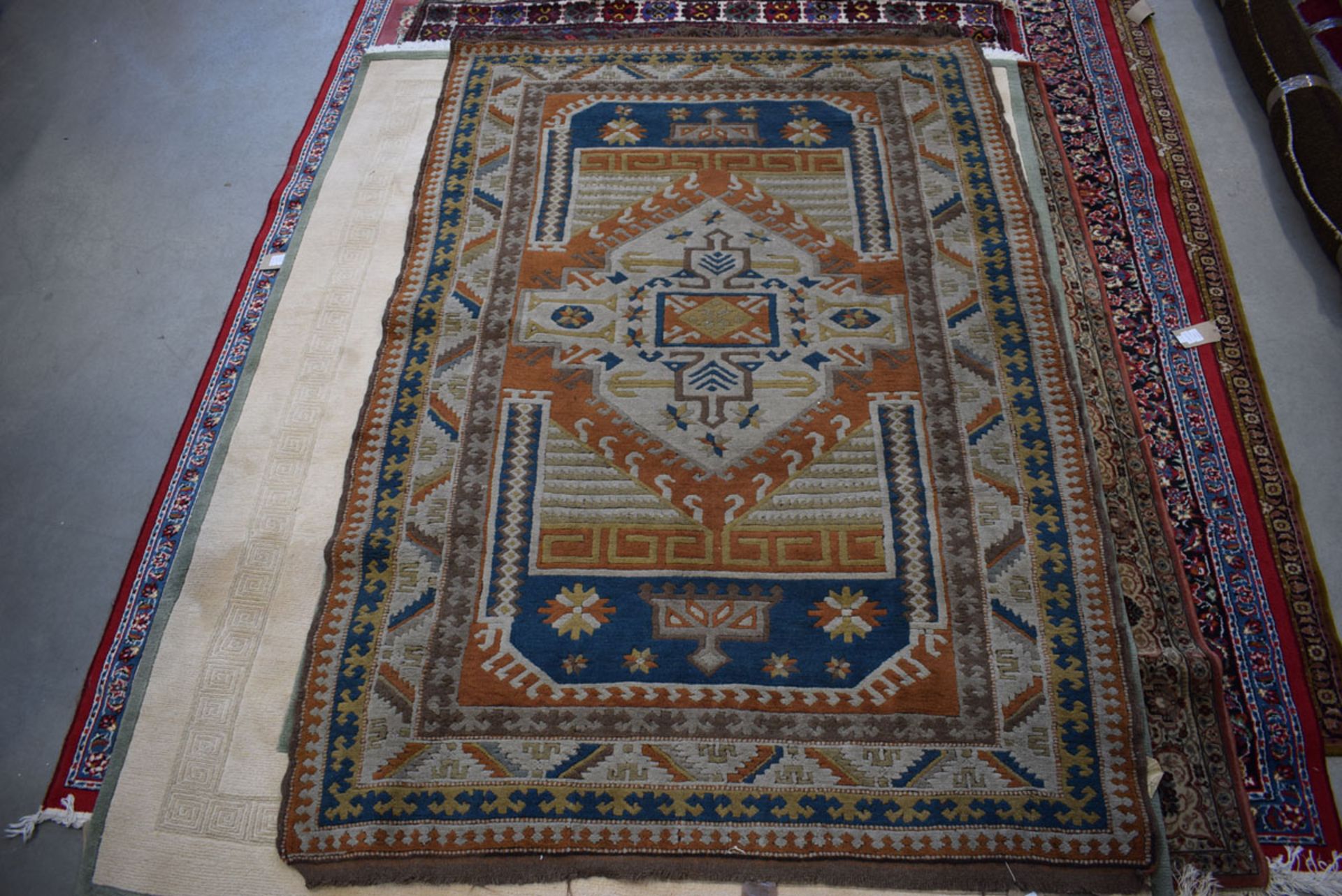 5152 (16) Afghan woolen carpet in shades of brown, cream, and blue approx. 1.6 x 2m