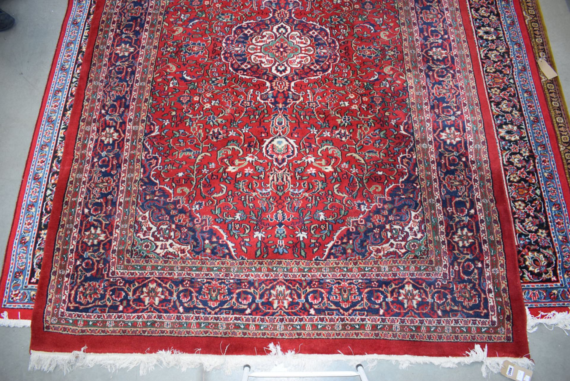 (11) Iranian carpet, red background and blue motifs, approx. 2 x 3m