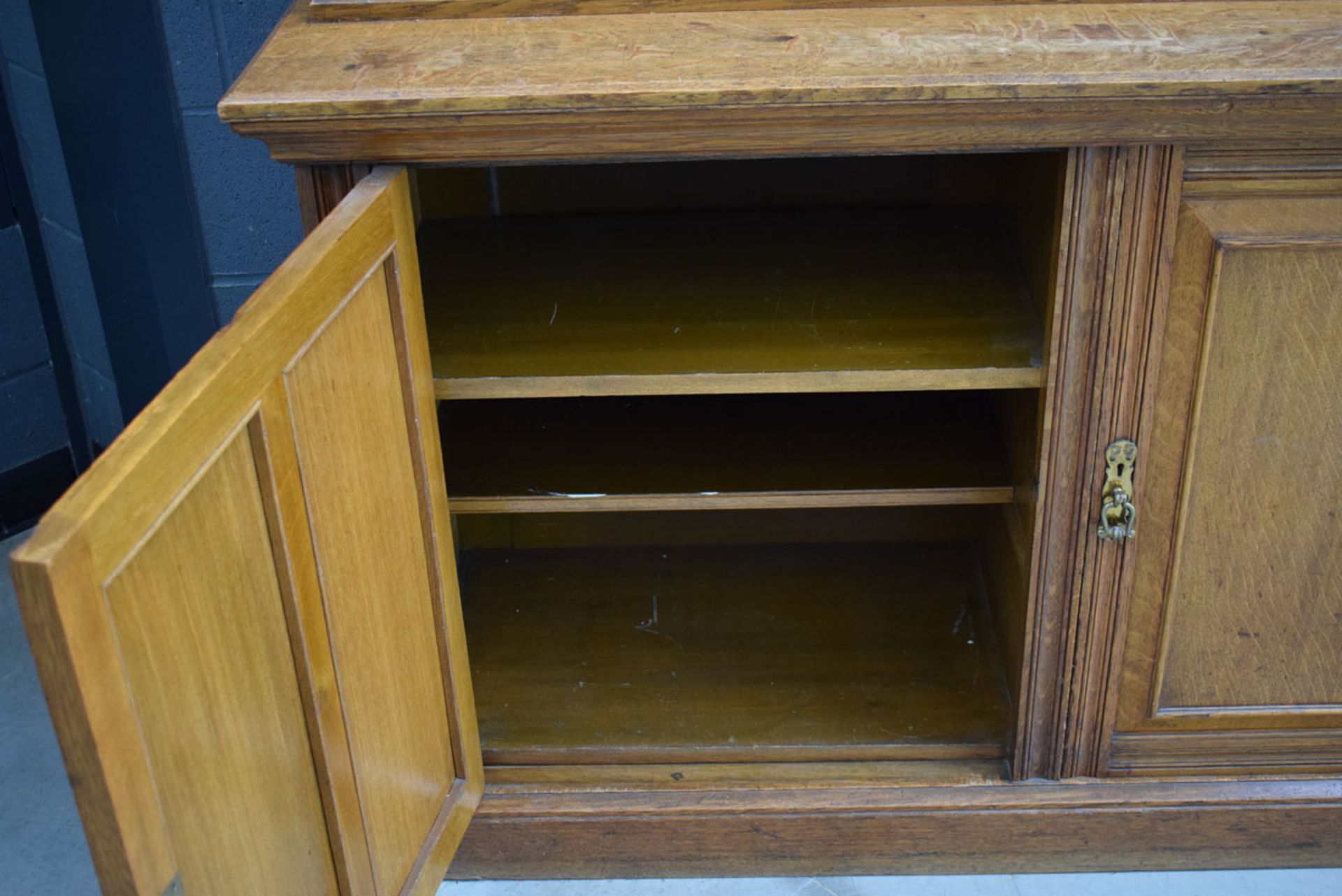 Glazed Victorian oak panelled three-door library bookcase with storage cupboards under and - Image 3 of 6