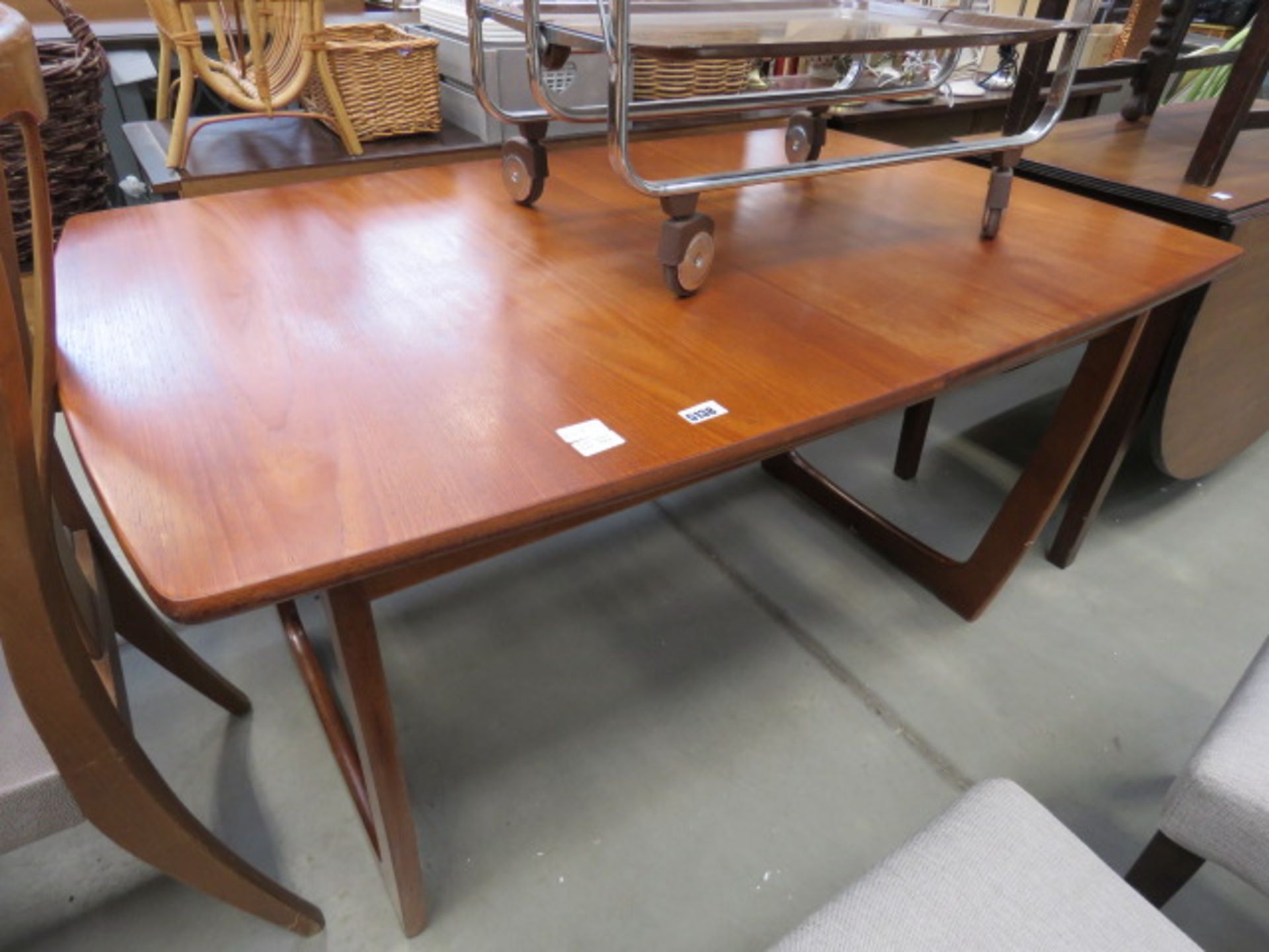 Portwood teak extending dining table Condition is fair with some marks