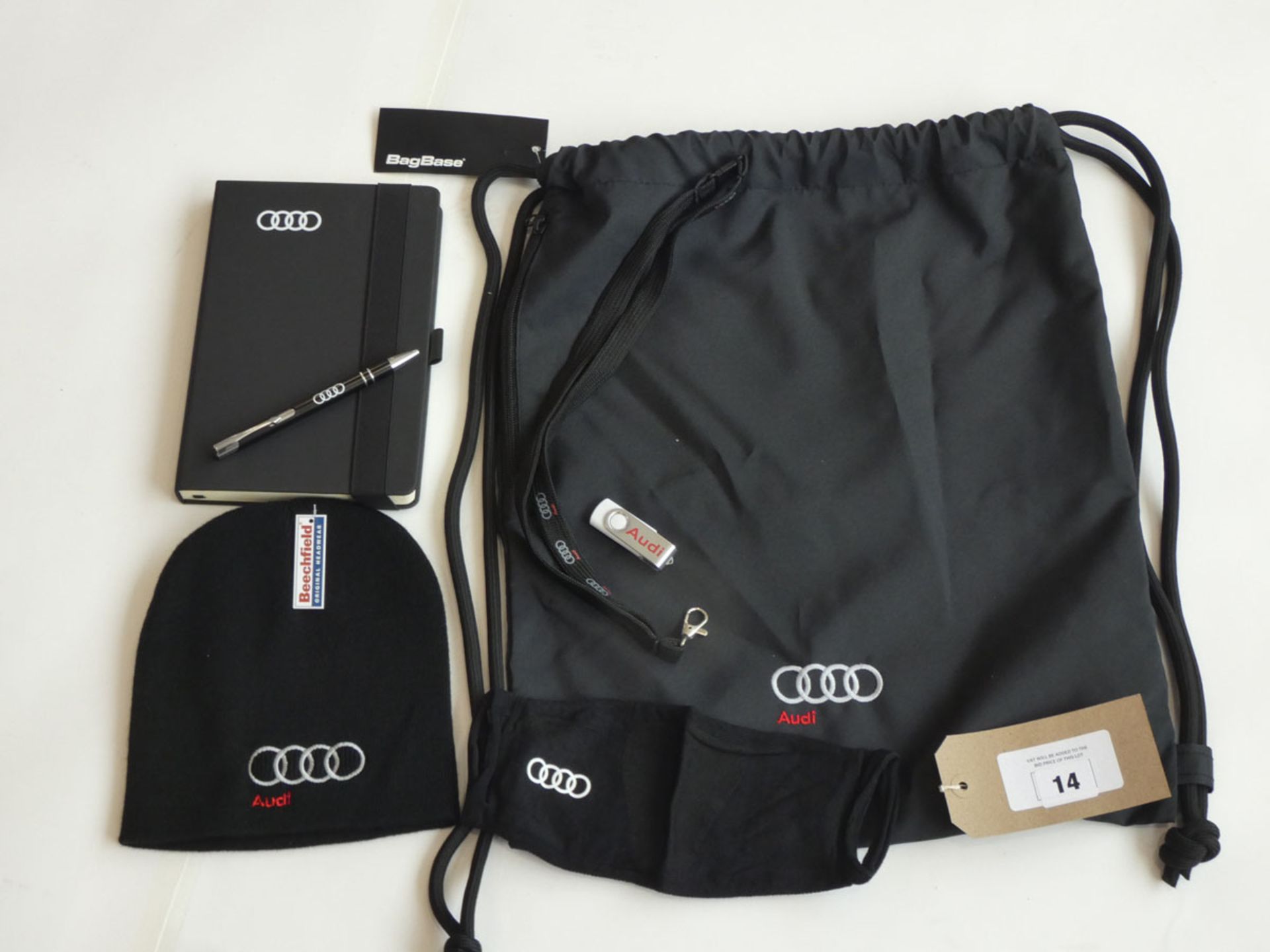 Selection of Audi merchandise to include bag, hat, mask, book, pen, USB stick and lanyard